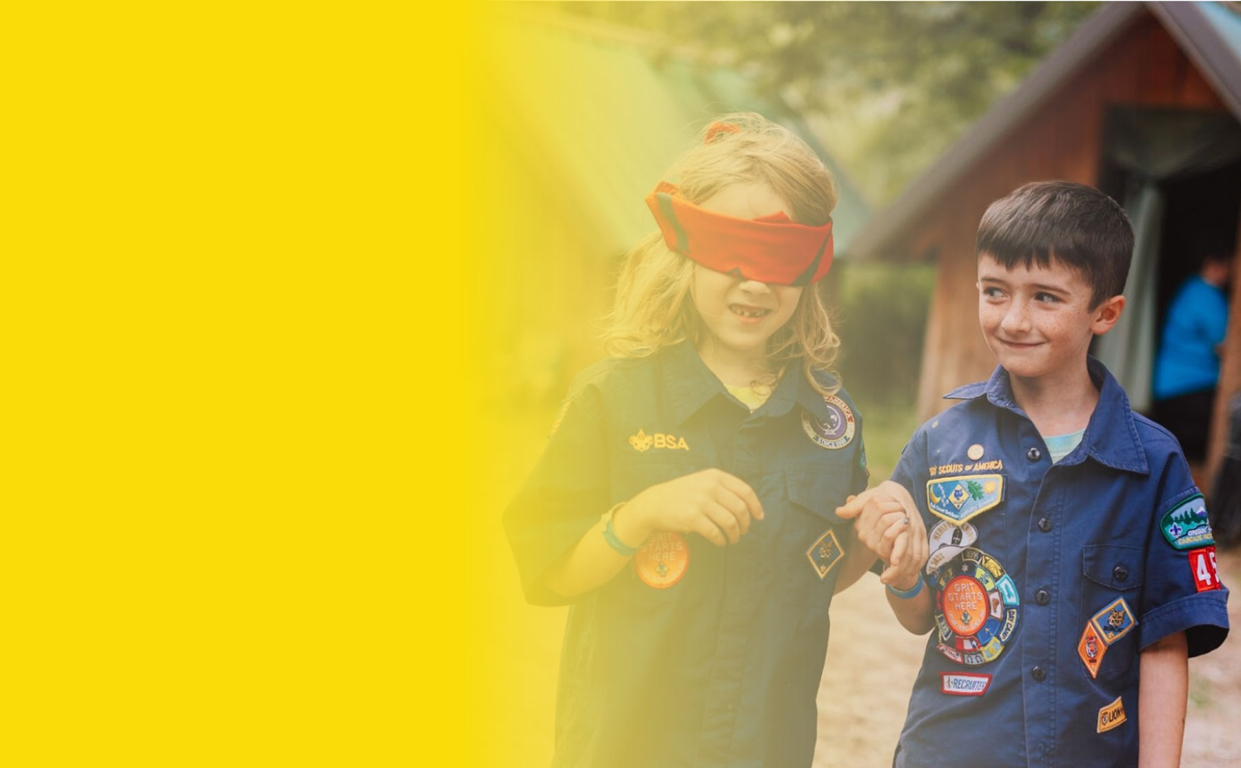 Pack 454 Cub Scouts in uniform showing their badges
