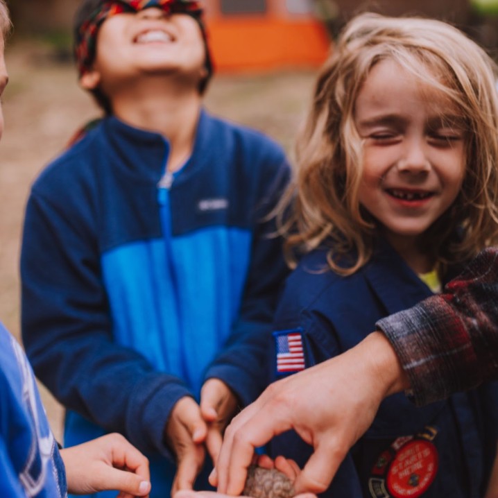 Pack 454 Cub Scouts laughing and playing together outdoors
