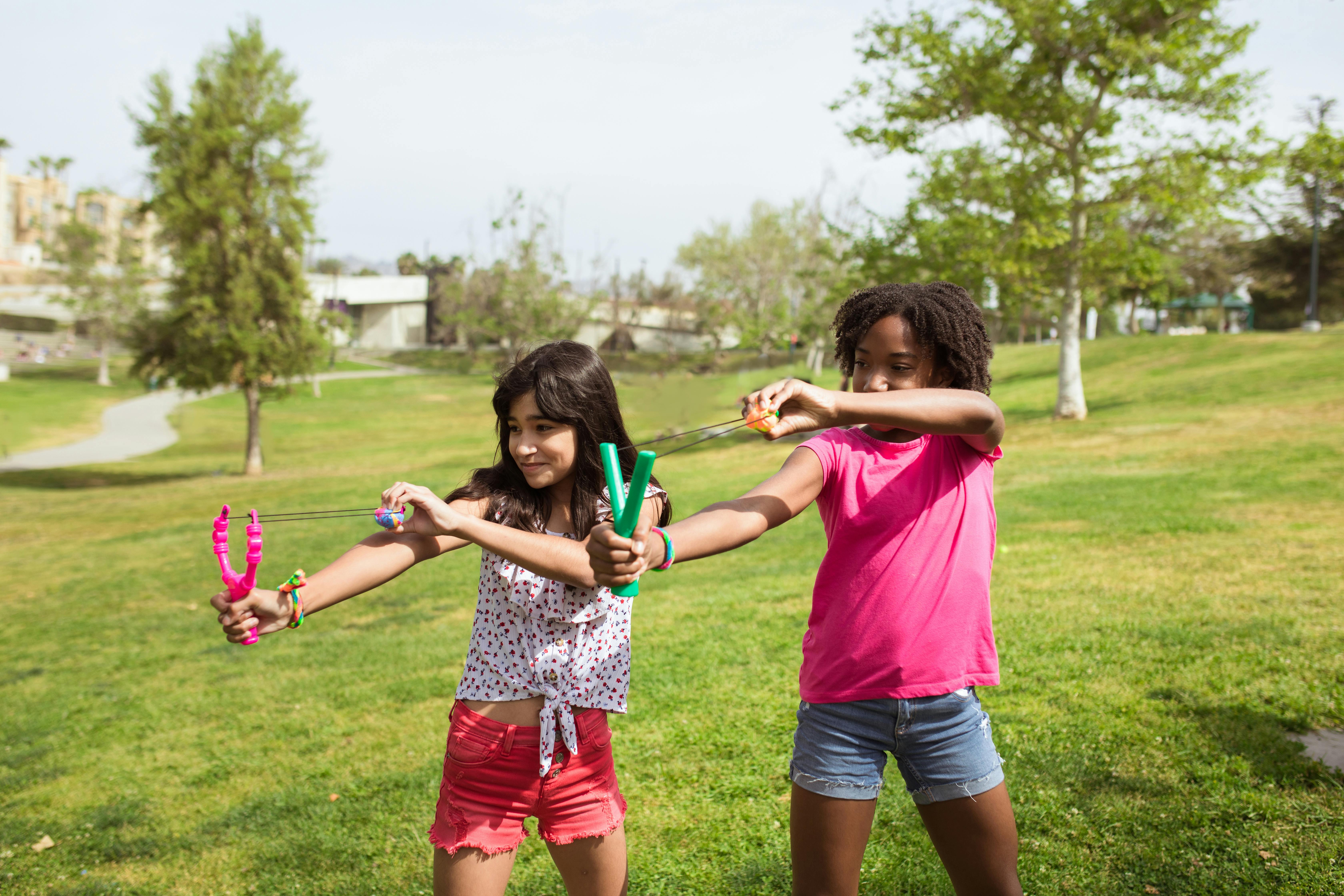 Kids enjoying an outdoor summer camp activity together